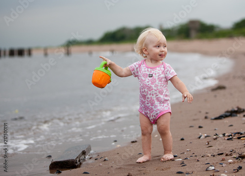 little girl playing on the beach