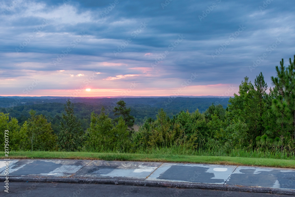The view of a sunrise from the parking lot of a scenic overlook in the Talladega National Forest, in Alabama, USA