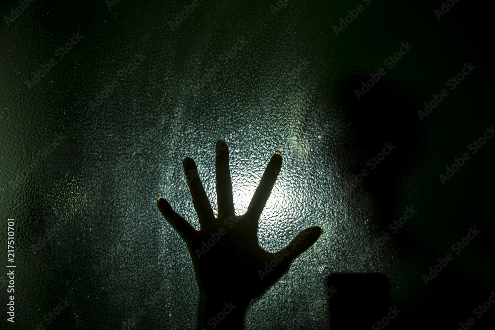 Silhouette of hand with glass Silhouette of hand with glass