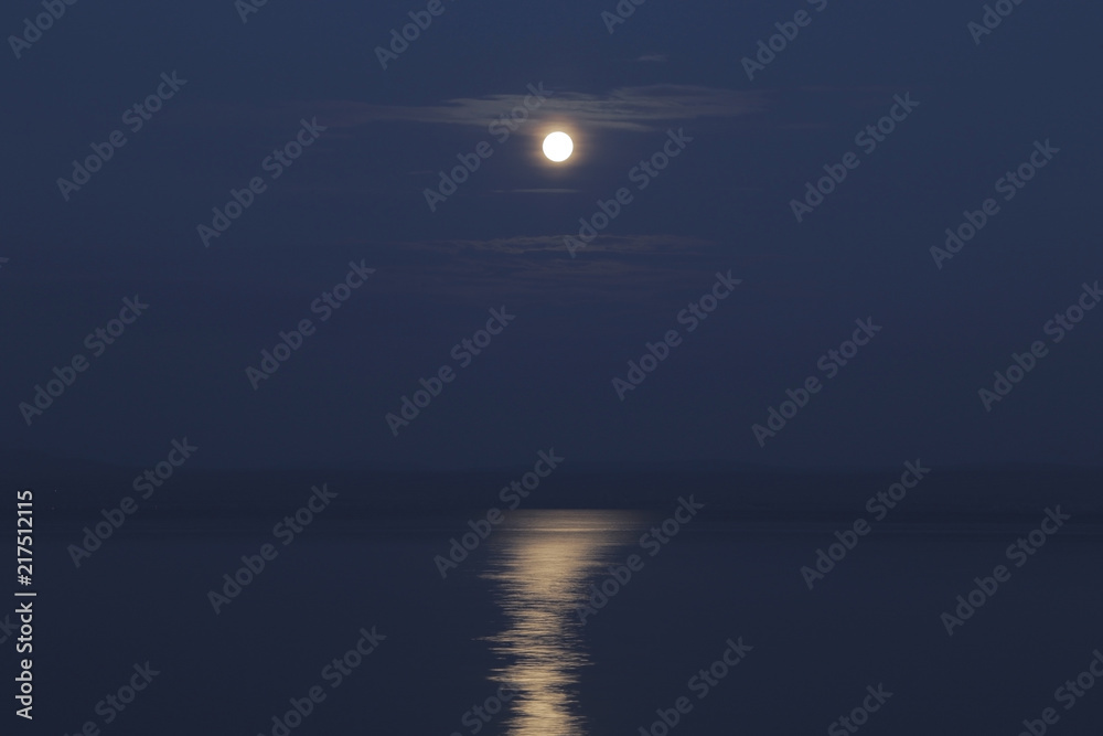 Lunar path on the sea water. Moonlight. Nature landscape.