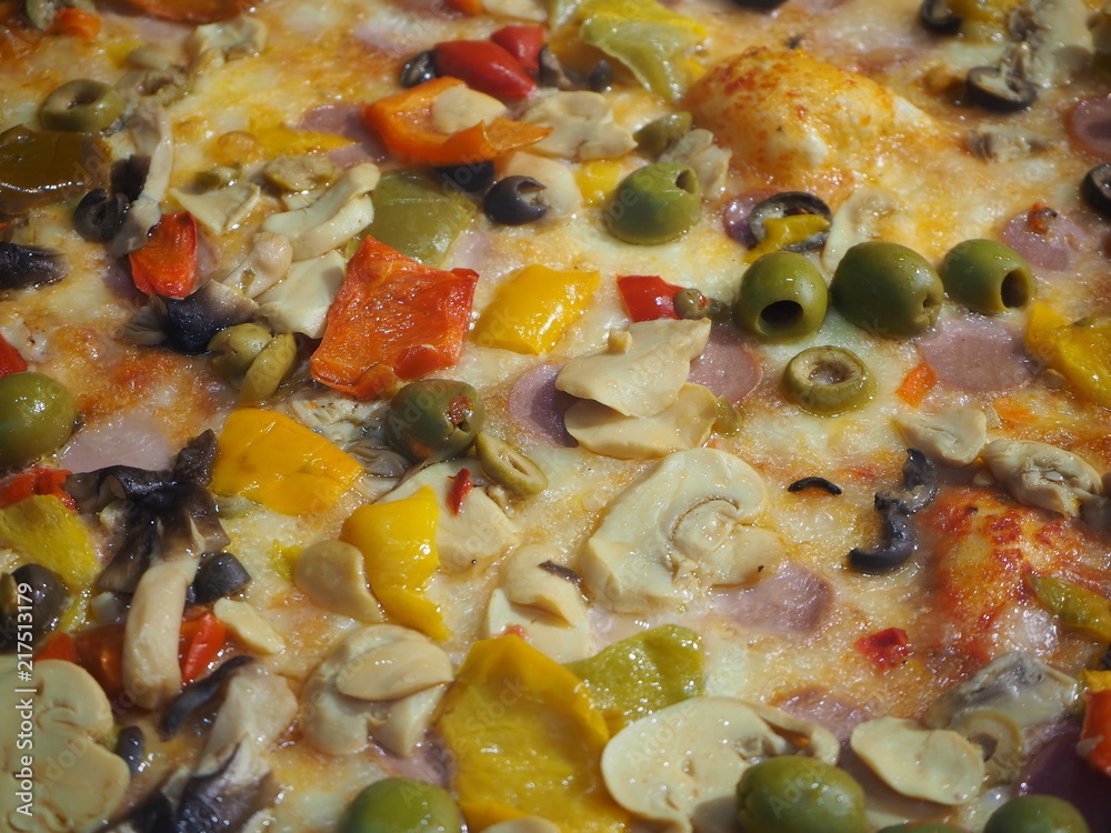 Delicious Italian pizza capricciosa, cooked in the wood oven Delicious Italian pizza capricciosa, cooked in the wood oven