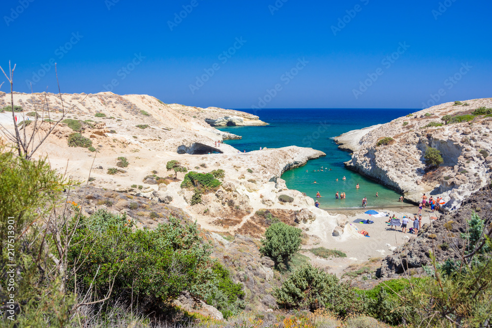 Kapros, small beach between volcanic rocks with turquoise sea on Milos island, Cyclades, Greece.