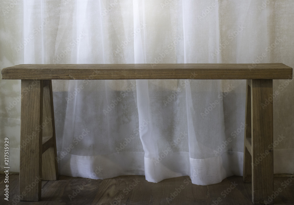 Warm cozy room with wooden bench Warm cozy room with wooden bench
