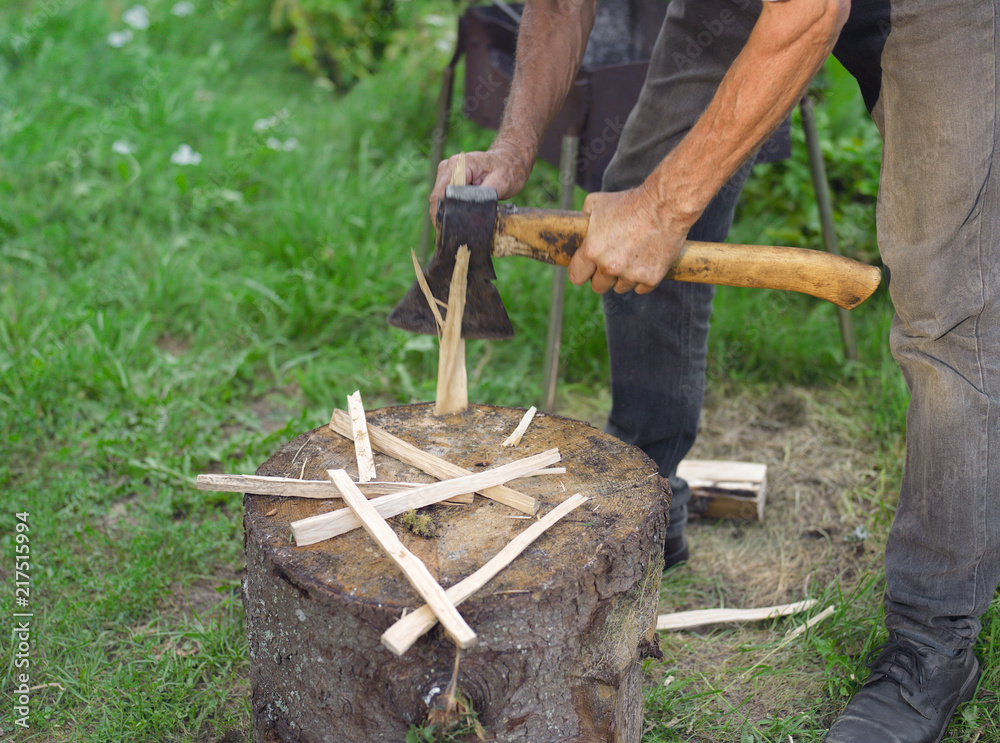 Fototapeta premium man chopping splinters