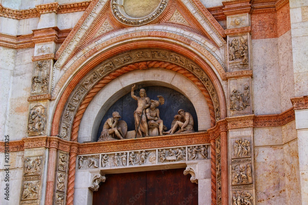 A closeup view of decorative elements of the facade of a cathedral in Bologna, Italy