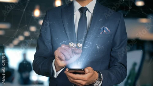 Businessman With Mobile Phone Opens Hologram HUD Interface and Touches Word - FMEA photo