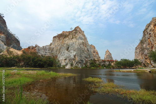 Beautiful Rocky mountain with water lake of khao Ngu Stone Park , Ratchaburi , Thailand.