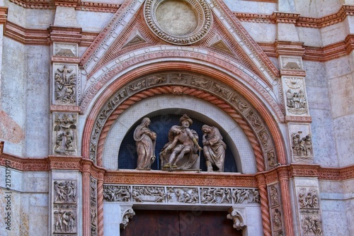 A closeup view of decorative elements of the facade of a cathedral in Bologna, Italy