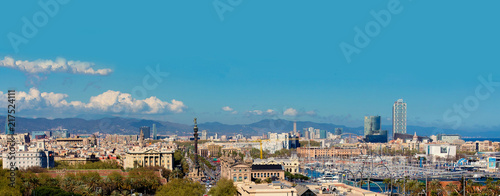 Aerial Panorama view of Barcelona city skyline over Passeig de Colom or Columbus avenue and Port Vell marina