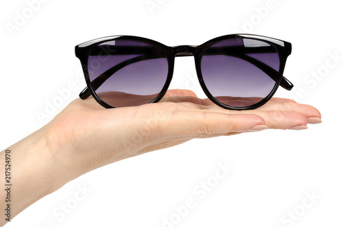 Stylish plastic sunglasses with hand isolated on white background