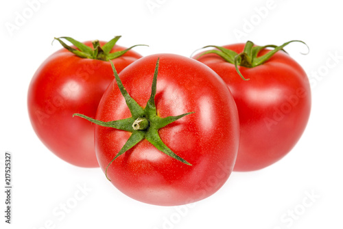 Fresh whole raw red tomato with green leaf, isolated on white background