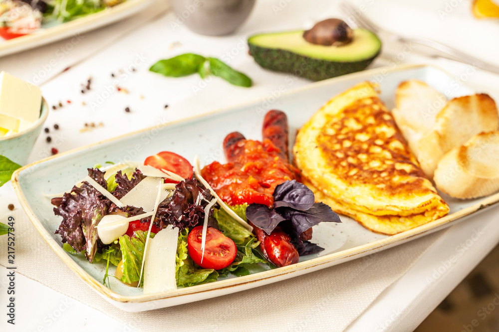 The concept of an Italian breakfast. omelette and salad. background image. Copy space, selective focus