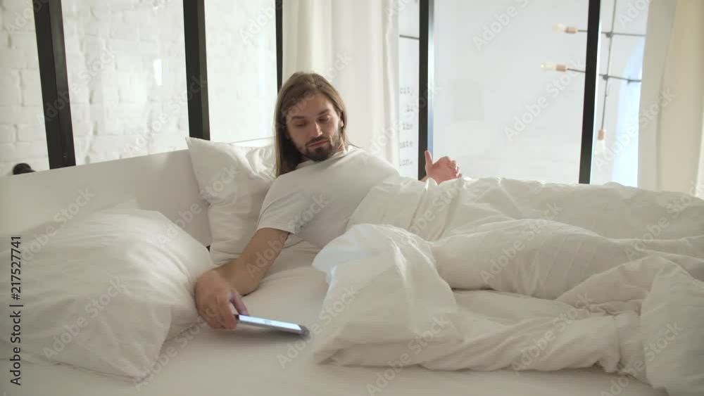 Wake Up. Man Sleeping In Bed With Phone Alarm Wake Up. Man Sleeping In Bed With Phone Alarm