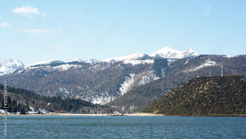 china travel lake view with fir in western china in pudacuo national park in shangri-la