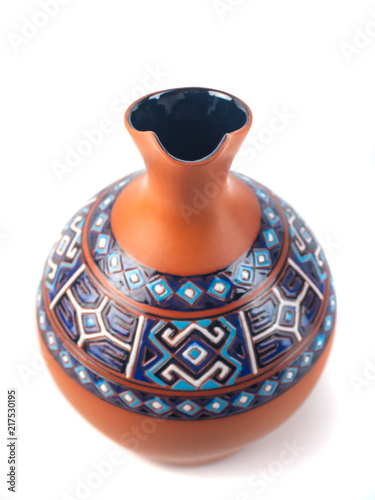 Georgian handmade ceramic jug with traditional ornaments on it, named Doqi, for wine and water on white background photo