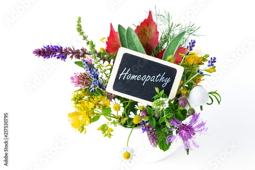 Little sign: Homeopathy in a bouquet of medical herbs and blooms photo