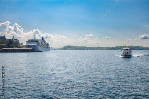 Oslo harbour in summer with cruise ship and ferry boat photo