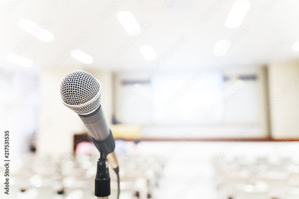 Fototapeta premium Microphone over the blurred business forum Meeting or Conference Training Learning Coaching Room Concept, Blurred background