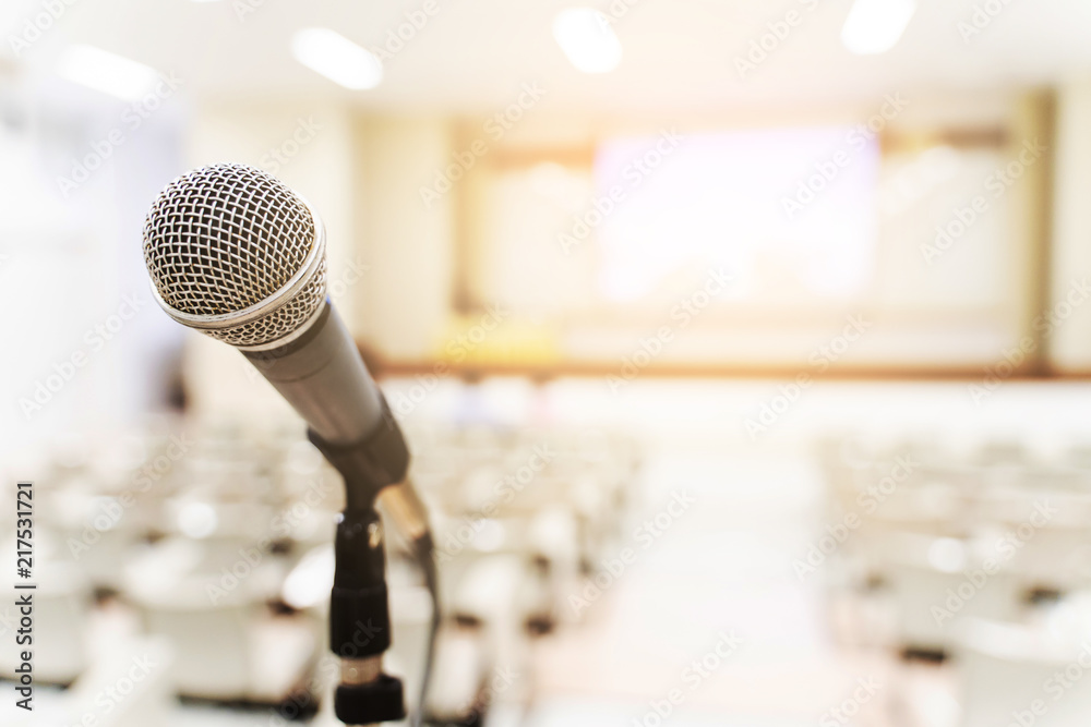 Microphone over the blurred business forum Meeting or Conference Training Learning Coaching Room Concept, Blurred background Microphone over the blurred business forum Meeting or Conference Training Learning Coaching Room Concept, Blurred background