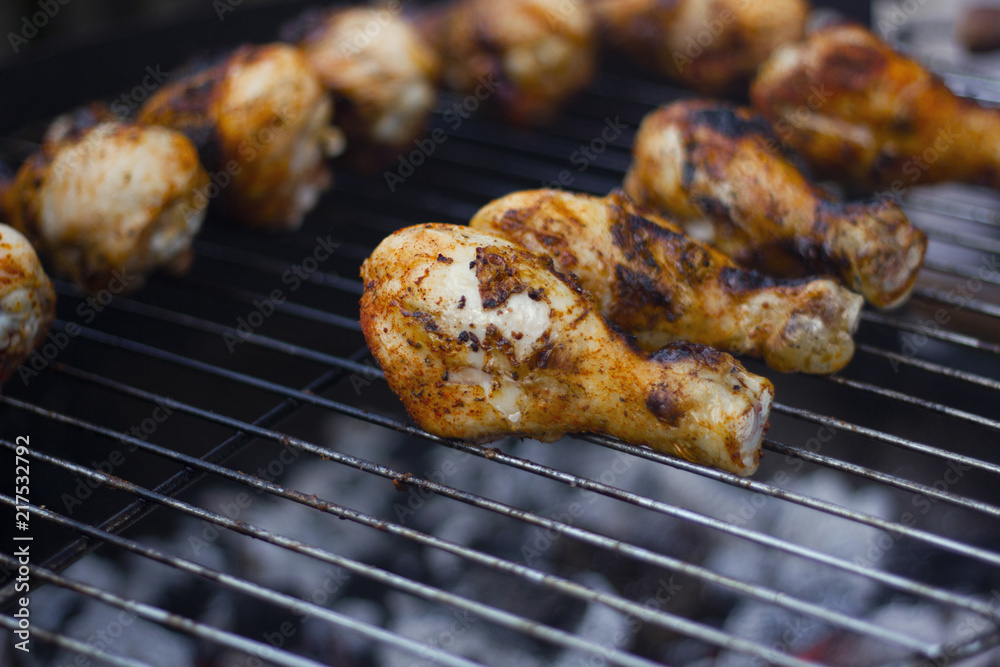 Grillled chicken drumsticks on the open grill