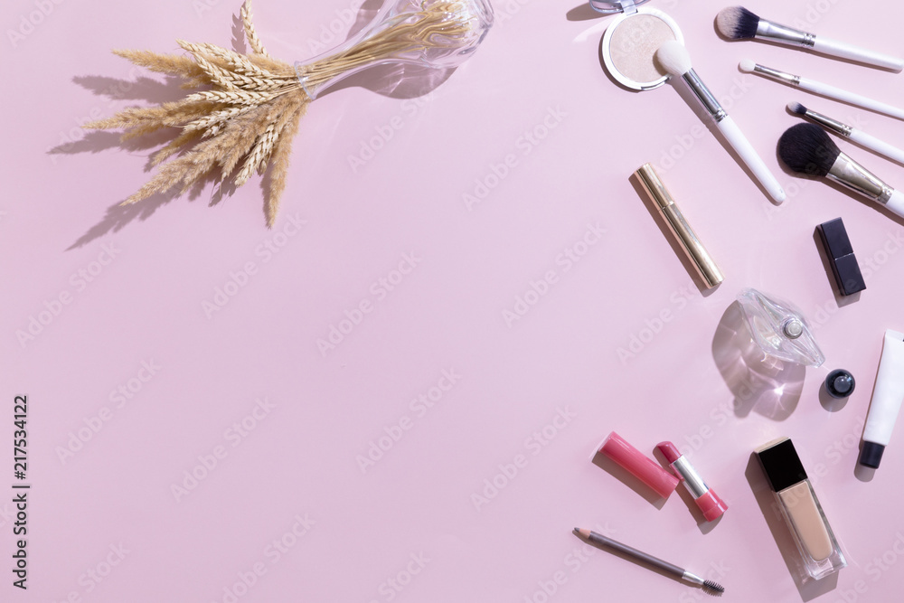 Pastel pink office table desk with beauty and make up accessories, cosmetics set, top view and flat lay. Home fashion women office workspace isolated on pink background. Pastel pink office table desk with beauty and make up accessories, cosmetics set, top view and flat lay. Home fashion women office workspace isolated on pink background.