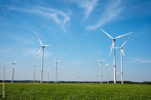 Modern wind energy generators on a sunny day seen in Germany