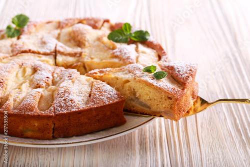 Fruit cake with icing sugar on top, served