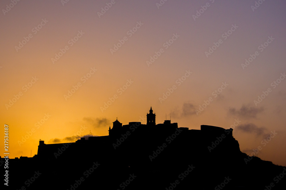 City of Victoria in Gozo, Malta in Europe. View over the city on the cathedral of Victoria in the sunset time