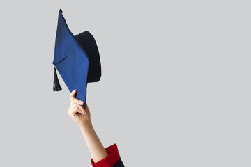 Graduate student rising up her cap