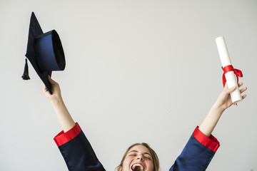 Young female student graduating from university