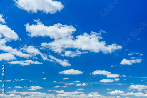 White fluffy clouds in deep blue sky