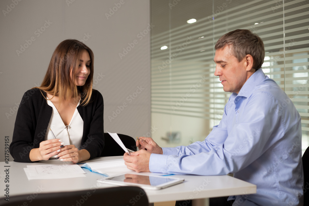 a man and a woman work in an office and talking a man and a woman work in an office and talking