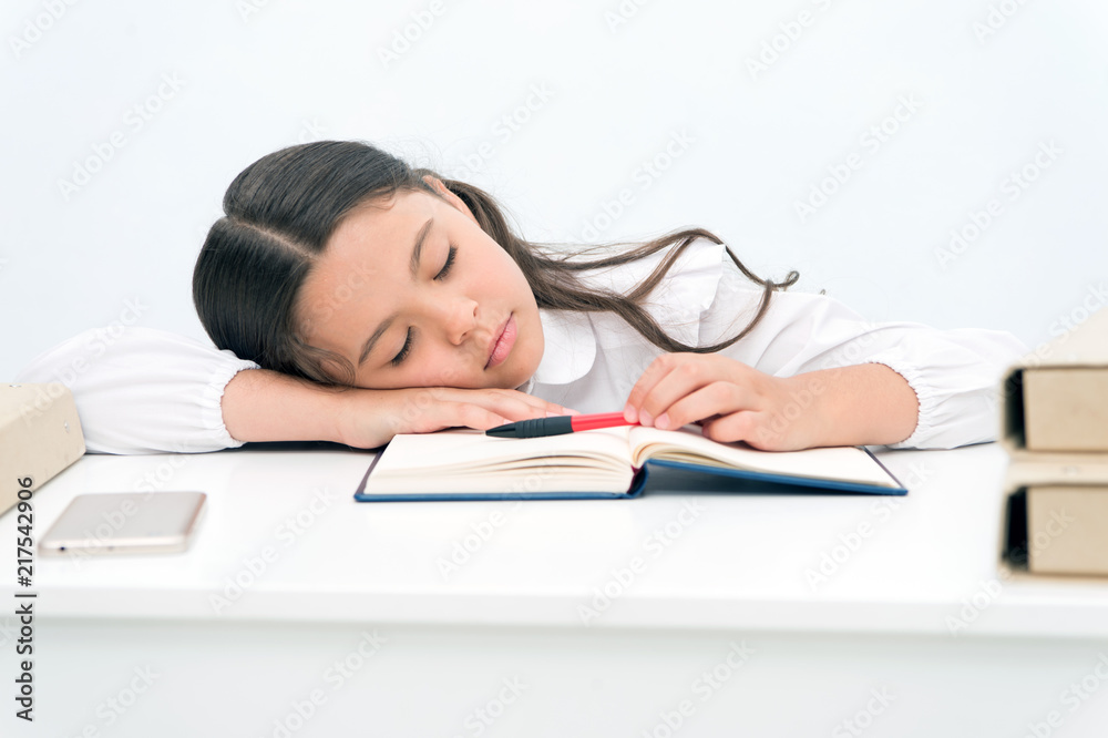 Nap concept. Tired schoolgirl have nap. Little girl taking nap at desk. It is a nap time Nap concept. Tired schoolgirl have nap. Little girl taking nap at desk. It is a nap time