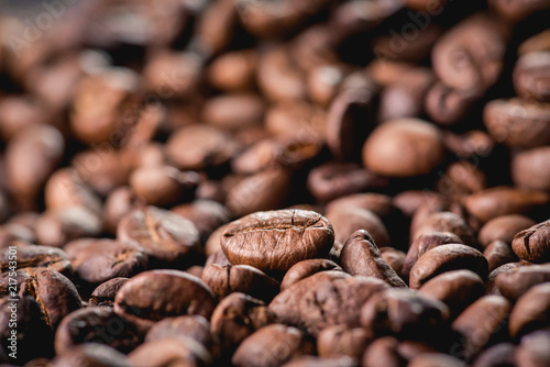 Close up of coffee beans are the background.