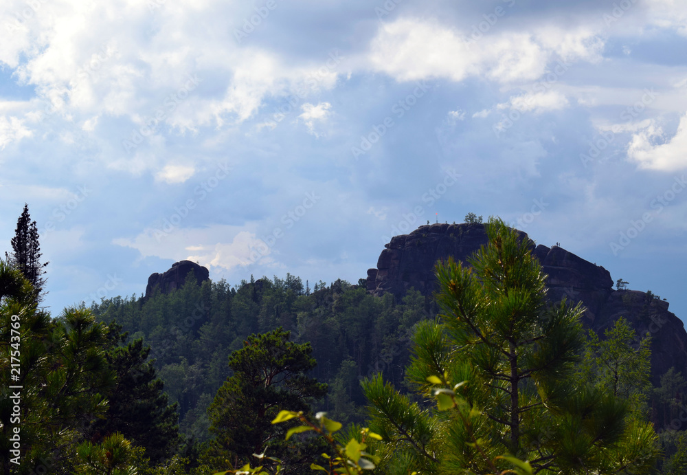 custom made wallpaper toronto digitalPicturesque view of the rocks surrounded by forest. Speleology. Rocky shore. High mountains against the sky. Mountaineering.