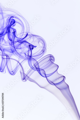 Purple smoke on a white background and texture. Isolated colorful smoke in a studio space. Mystical artwork and shape.