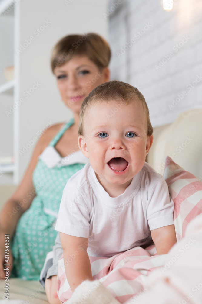Mom with the baby at home in the room Mom with the baby at home in the room