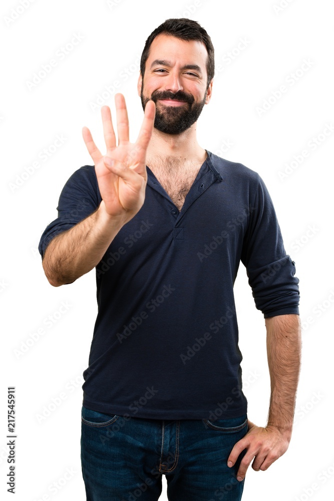 Handsome man with beard counting four Handsome man with beard counting four