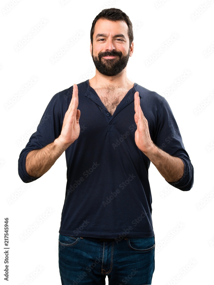 Handsome man with beard holding something Handsome man with beard holding something