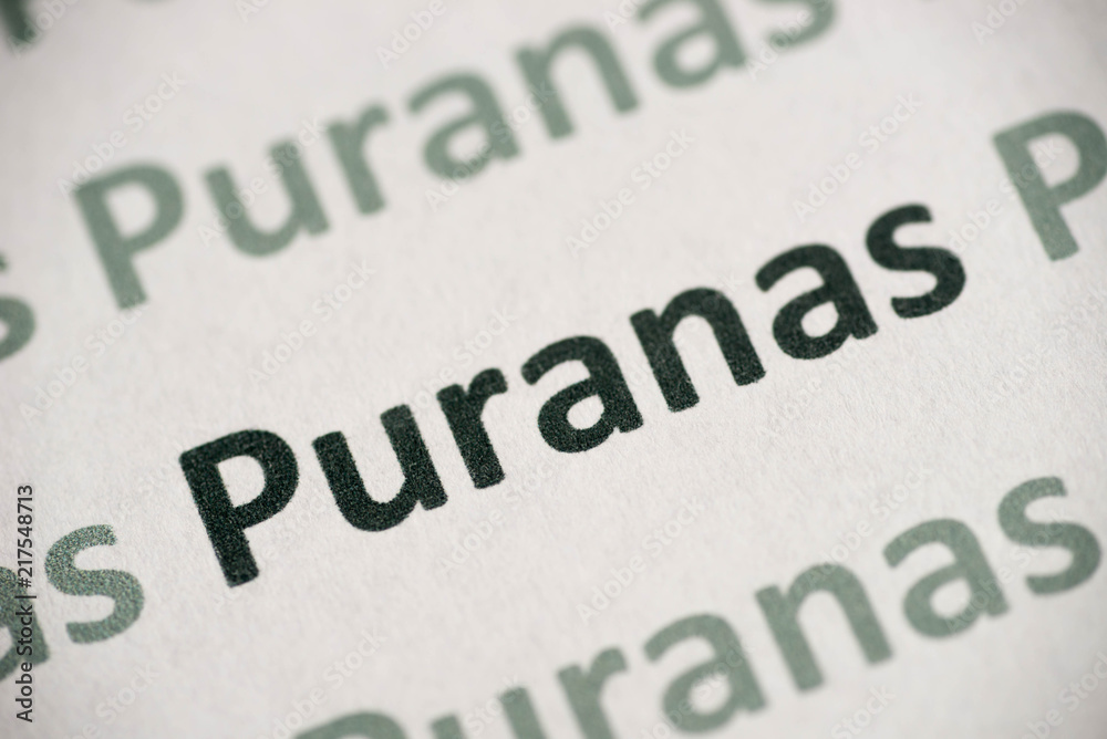 word Puranas  printed on paper macro