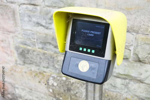 Digital bank credit card reader located outdoors at train station car park
