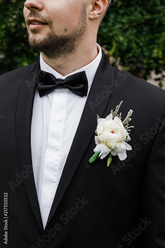 Handsome elegant bearded groom. Stylish wedding grooms photo.