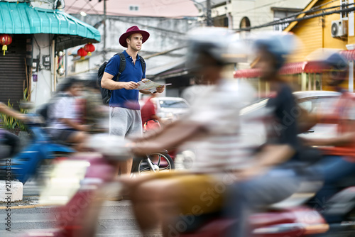 Traveler on asian city street. Daylight shooting. © Andriy Bezuglov