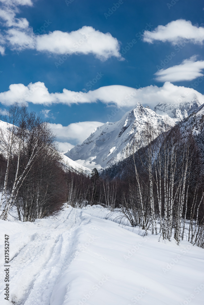 A road in the winter Caucasus mountains. Alibek, Dombai, Russia.
