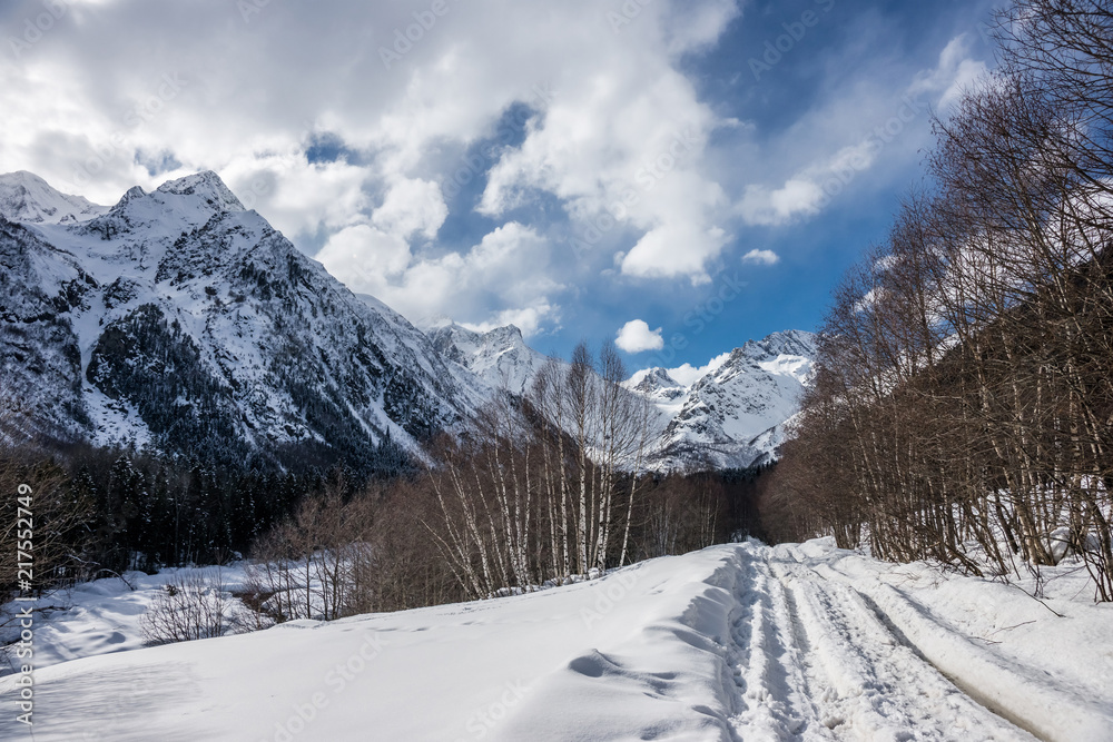 A road in the winter Caucasus mountains. Alibek, Dombai, Russia.