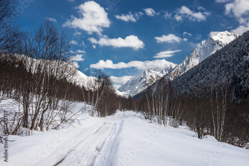 A road in the winter Caucasus mountains. Alibek, Dombai, Russia.