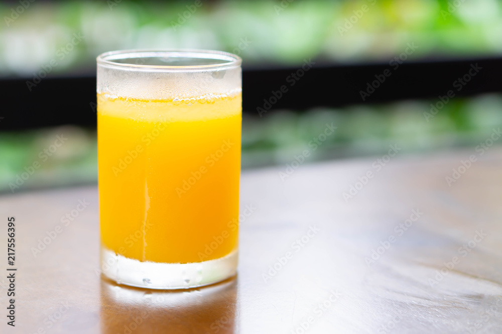 Closeup orange juice on wood table, drink for healthy concept, selective focus Closeup orange juice on wood table, drink for healthy concept, selective focus