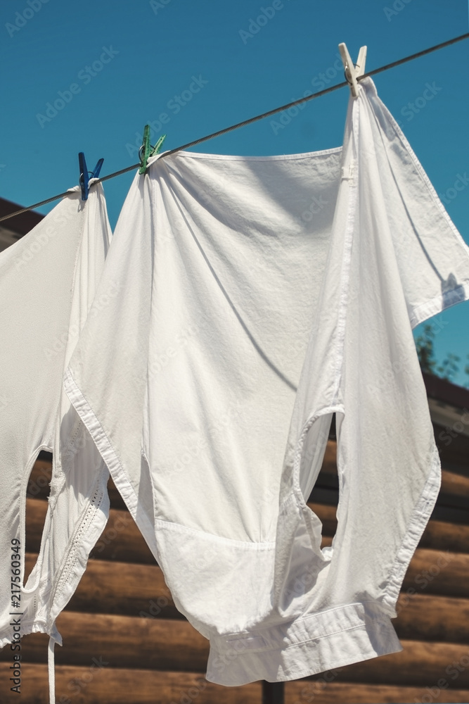 White clean clothes on the rope outdoors