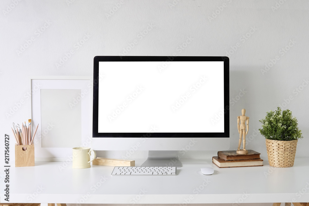Mockup Pc computer on white table and designer office supplies on desk with workspace. Mockup Pc computer on white table and designer office supplies on desk with workspace.