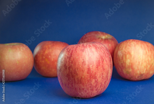 Pink apples on a blue background